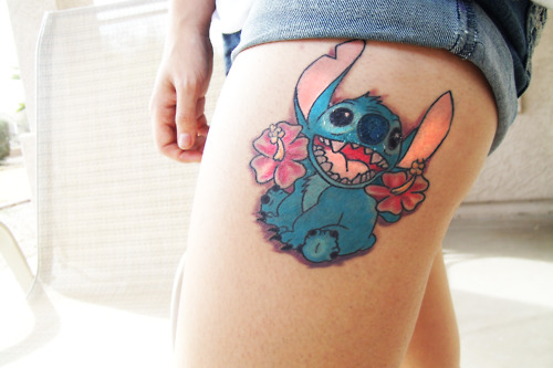Stitch With Flower Tattoo On Side Thigh
