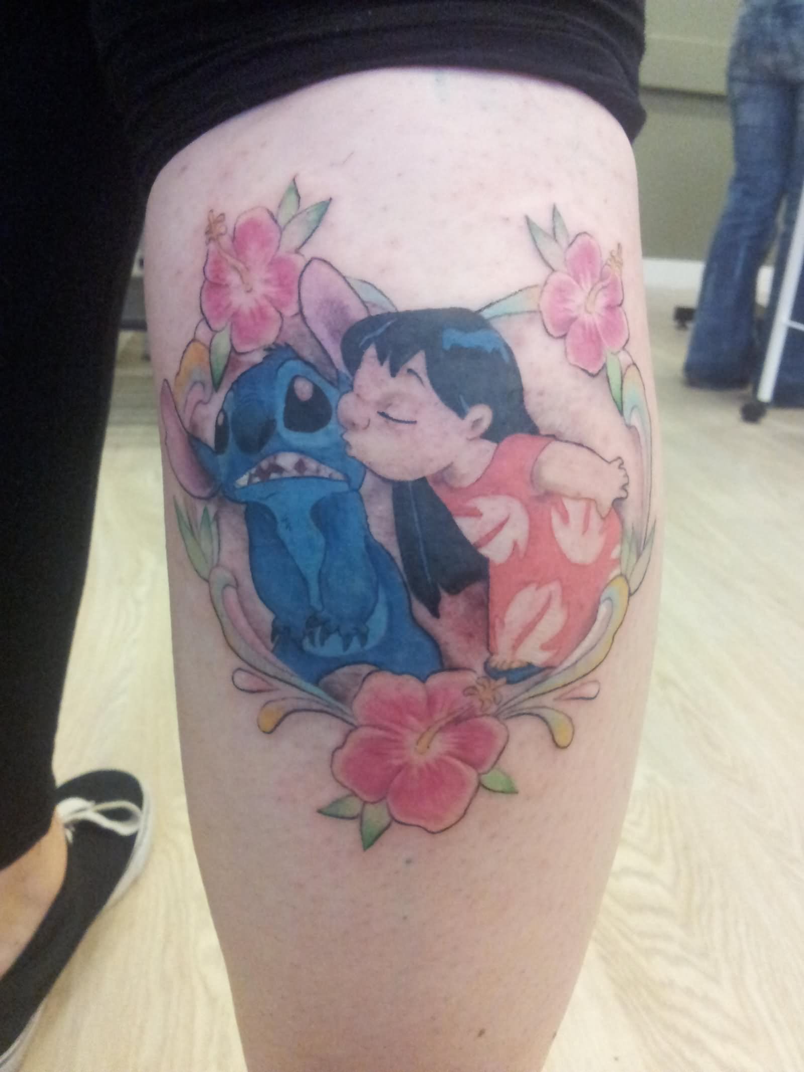 Stitch With Lilo In Flower Frame Tattoo On Leg Calf