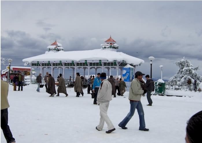 Tourists Walking On Snow At The Ridge