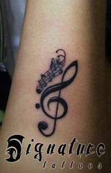 Violin Key Symbol Tattoo Design For Forearm