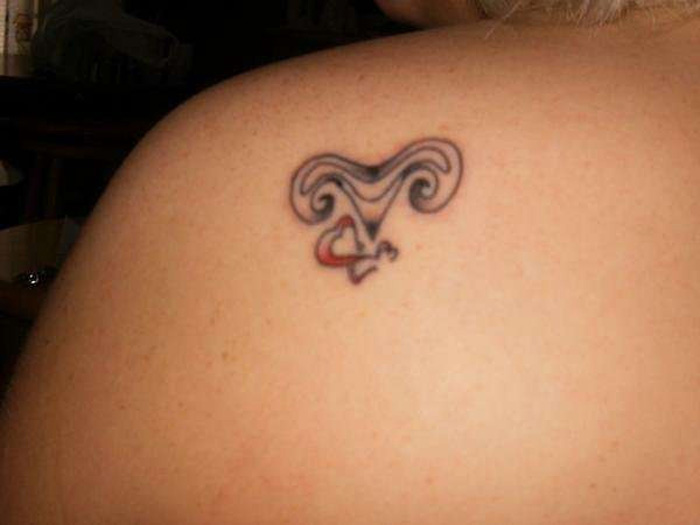 Zodiac Aries Symbol Tattoo On Women Left Back Shoulder