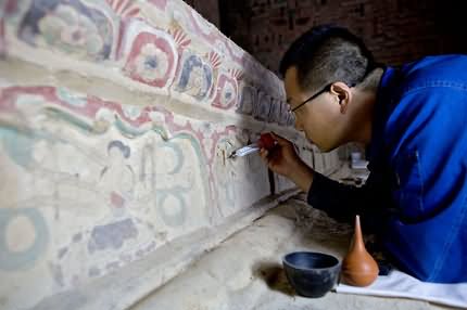 A Technician Restores One Of The Mogao Caves In Dunhuang, China