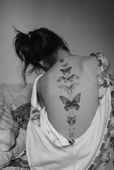 Amazing Butterflies Tattoo On Girl Upper Back