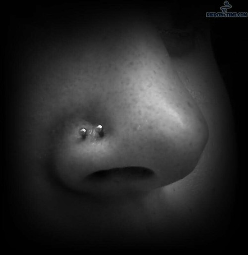 Amazing Double Nose Piercing With Silver Studs