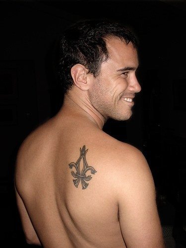 Amazing Fleur De Lis Tattoo On Man Upper Right Back