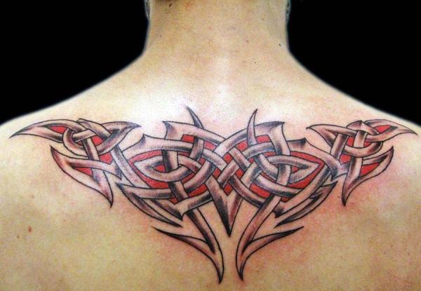 Amazing Tribal Design Tattoo On Upper Back