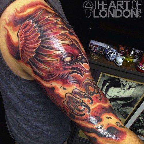 Attractive Phoenix Tattoo On Right Half Sleeve