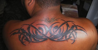 Back Tribal Tattoo On Man Upper Back By CraZyRaj