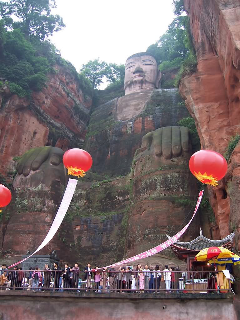 Balloons In Front Of Giant Buddha Statue In Leshan, China