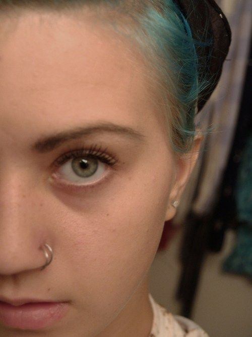 Beautiful Girl With Double Nose Piercing With Silver Rings