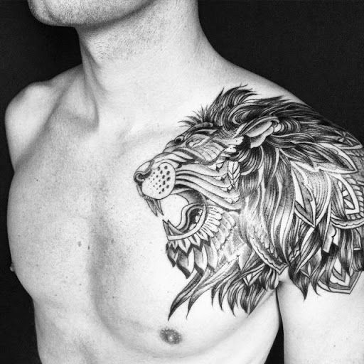 Black And White Lion Head Shoulder Tattoo
