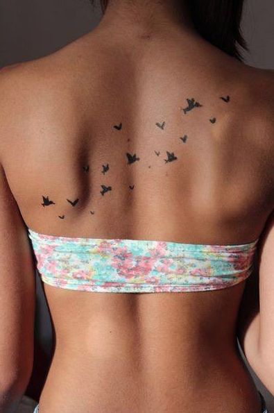 Black Flying Birds Tattoo On Girl Upper Back