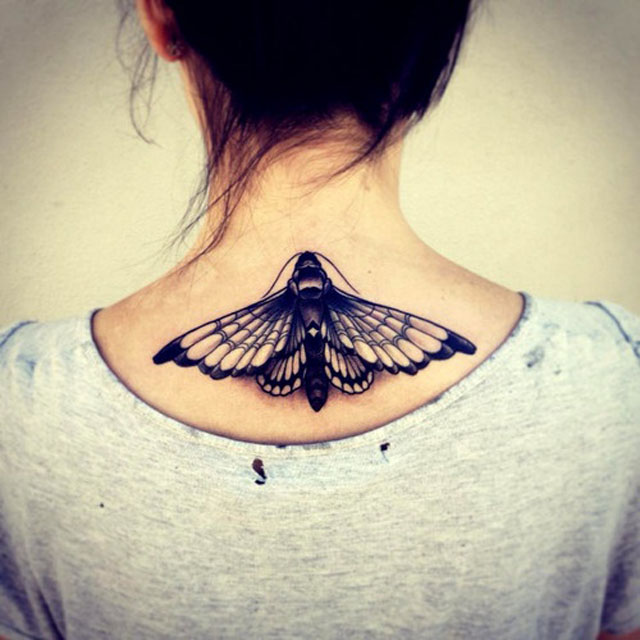 Black Ink Butterfly Tattoo On Girl Upper Back