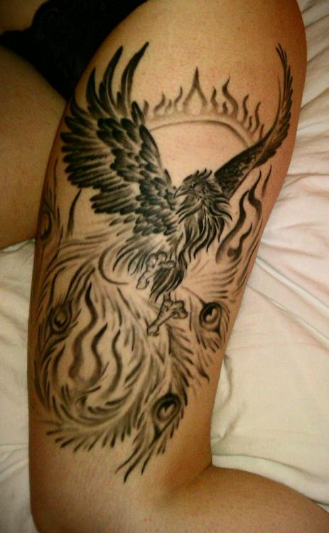 Black Ink Phoenix Tattoo On Girl Left Upper Leg