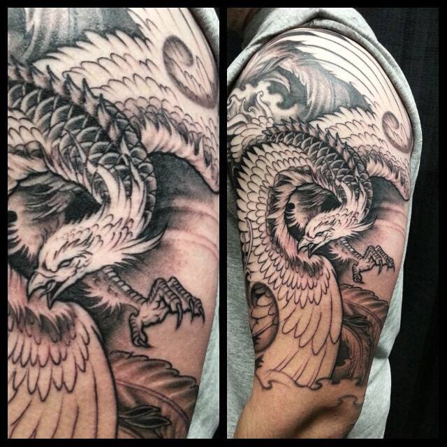 Black Ink Phoenix Tattoo On Left Half Sleeve
