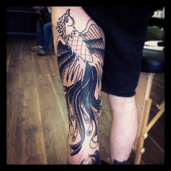 Black Ink Phoenix Tattoo On Left Leg