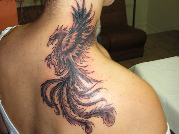 Black Ink Phoenix Tattoo On Upper Side Back