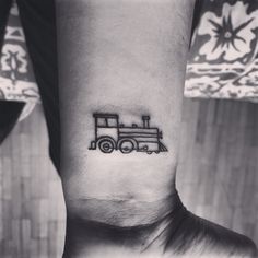 Black Outline Freight Train Tattoo On Wrist
