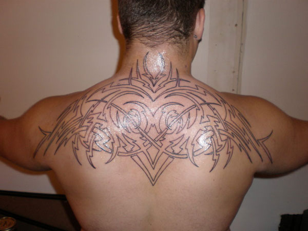 Black Outline Tribal Design Tattoo On Man Upper Back