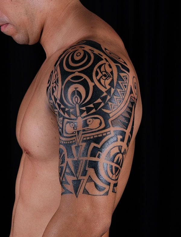 Black Tribal Tattoo On Man Left Shoulder