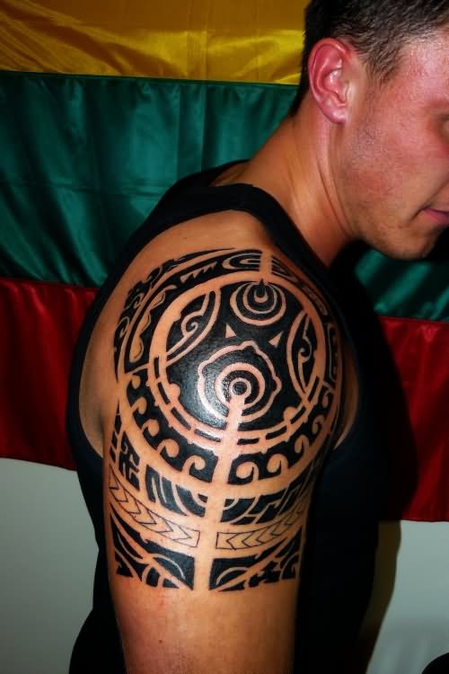Black Tribal Tattoo On Man Shoulder