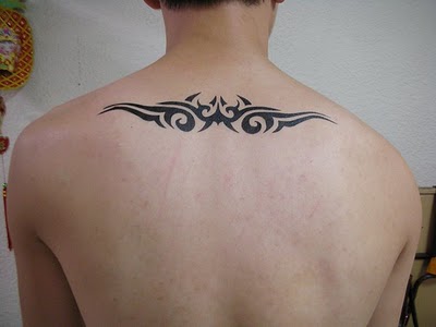Black Tribal Tattoo On Man Upper Back
