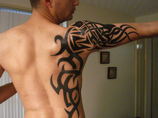 Black Tribal Tattoo On Right Shoulder And Half Sleeve