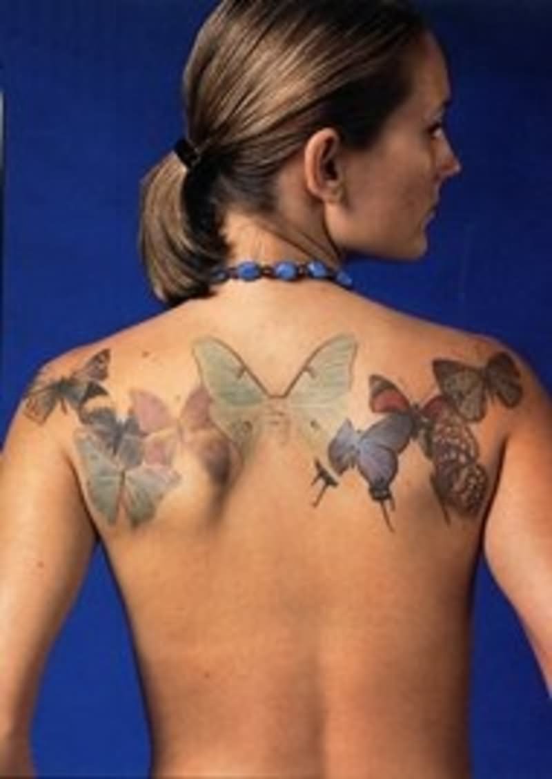 Colorful Butterflies Tattoo On Upper Back