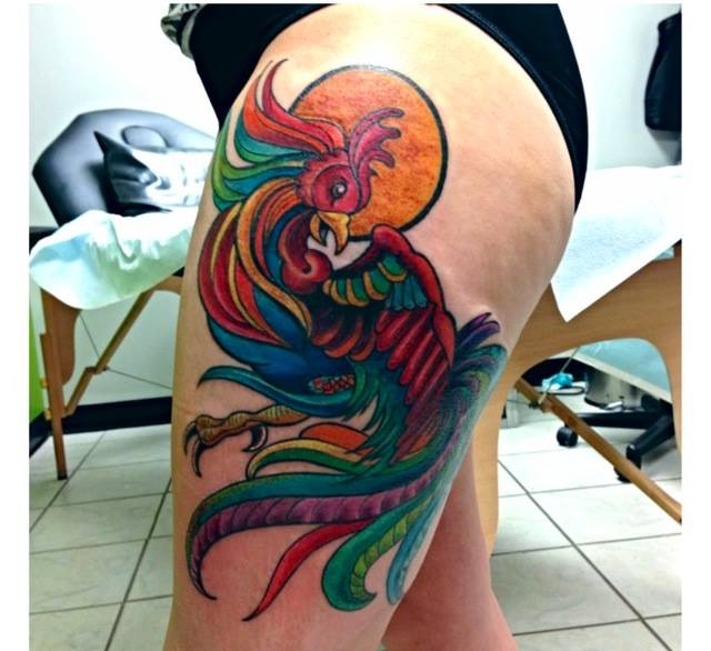 Colorful Phoenix Tattoo On Girl Left Upper Leg