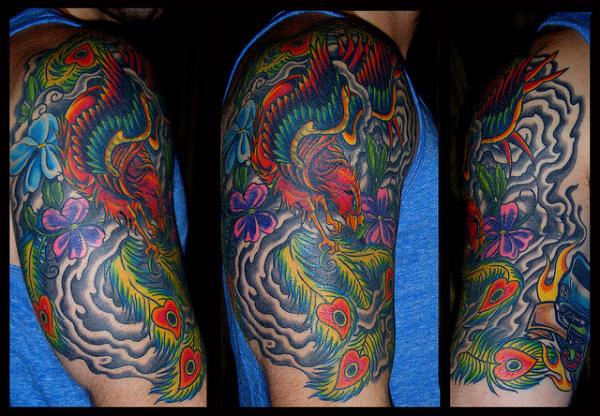 Colorful Phoenix Tattoo On Man Right Half Sleeve