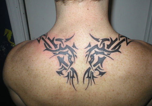 Cool Black Tribal Tattoo On Man Upper Back