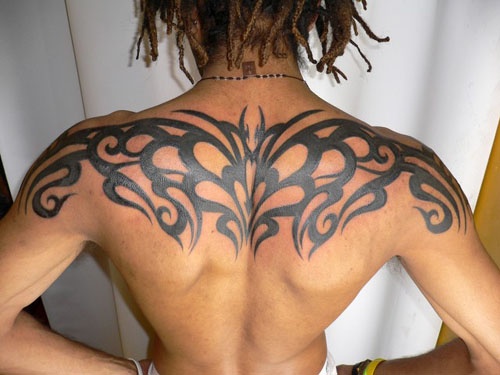 Cool Black Tribal Tattoo On Man Upper Back