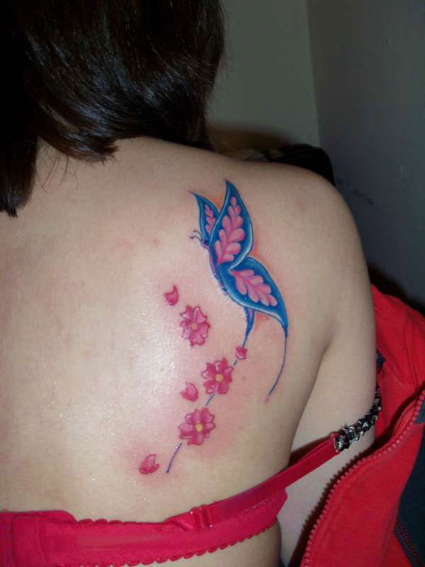 Cool Pink And Blue Butterfly Tattoo On Girl Upper Side Back
