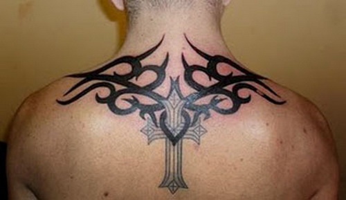 Cross With Tribal Design Tattoo On Man Upper Back