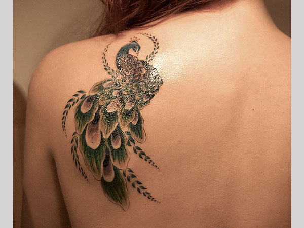 Cute Peacock Tattoo On Girl Upper Side Back