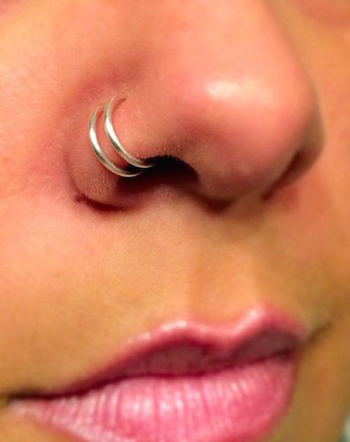 Double Nose Piercing With Silver Rings