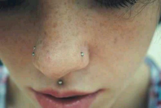 Girl Have Medusa And Double Nose Piercing With Silver Studs