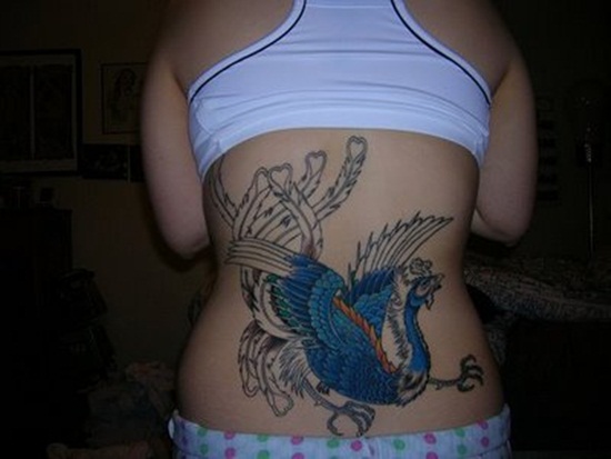 Girly Phoenix Tattoo On Girl Lower Back