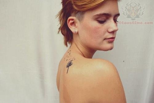 Grey Ink Dandelion Tattoo On Girl Upper Side Back