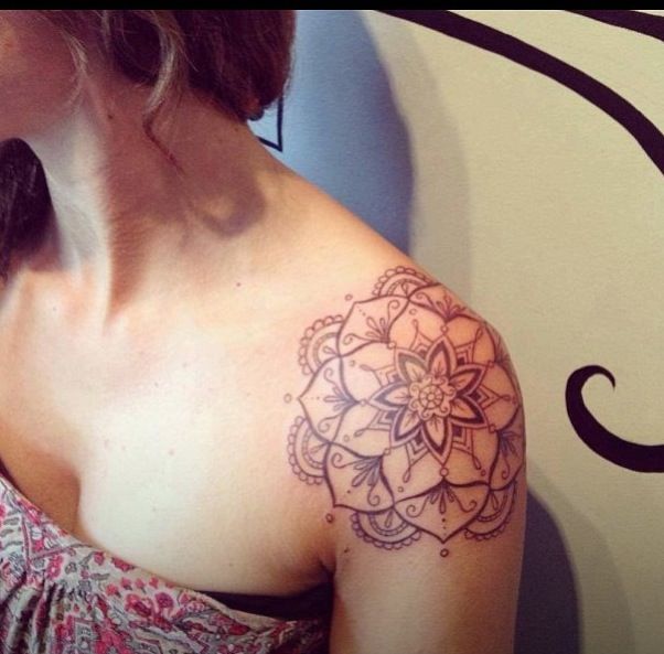 Grey Ink Flower Tattoo On Girl Left Shoulder