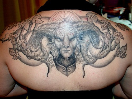 Grey Ink Horned Monster Tattoo On Upper Back