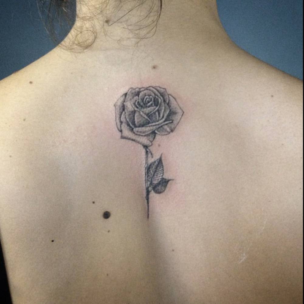 Grey Ink Rose Tattoo On Upper Back