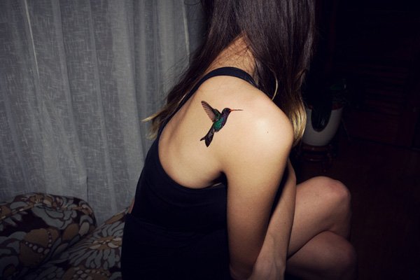 Hummingbird Tattoo On Girl Upper Side Back