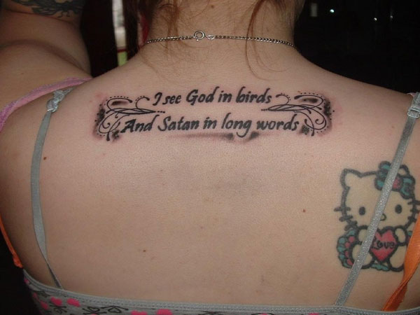 I See God In Birds And Satan In Long Words - Hello Kitty Tattoo On Upper Back