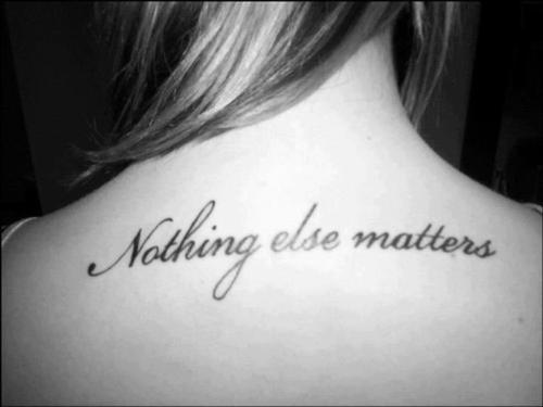 Nothing Else Matters Quote Tattoo On Girl Upper Back