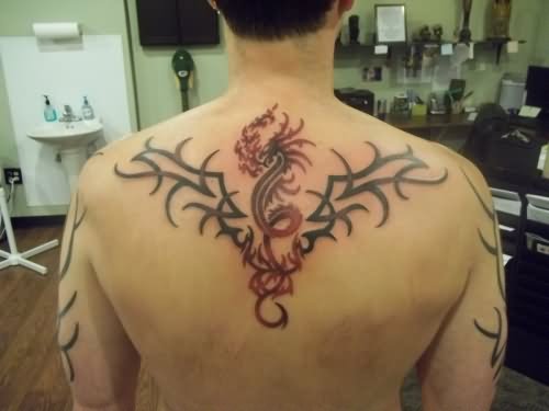 Red And Black Tribal Dragon Tattoo On Man Upper Back