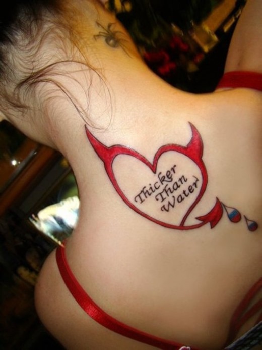 Red Devil Heart Tattoo On Girl Upper Back