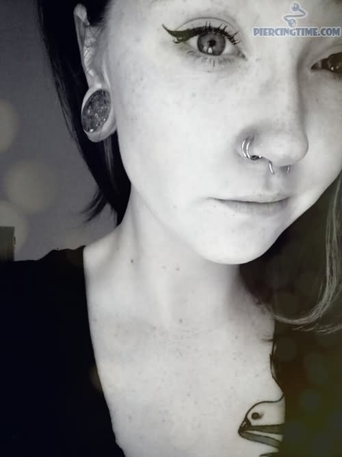 Right Ear Lobe And Double Nose Piercing Picture