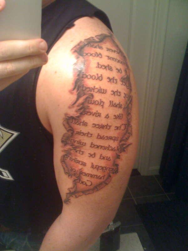 Ripped Skin Lettering Tattoo On Left Shoulder