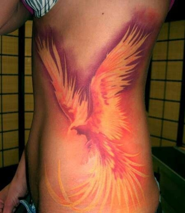 Rising Phoenix From The Ashes Tattoo On Girl Side Rib